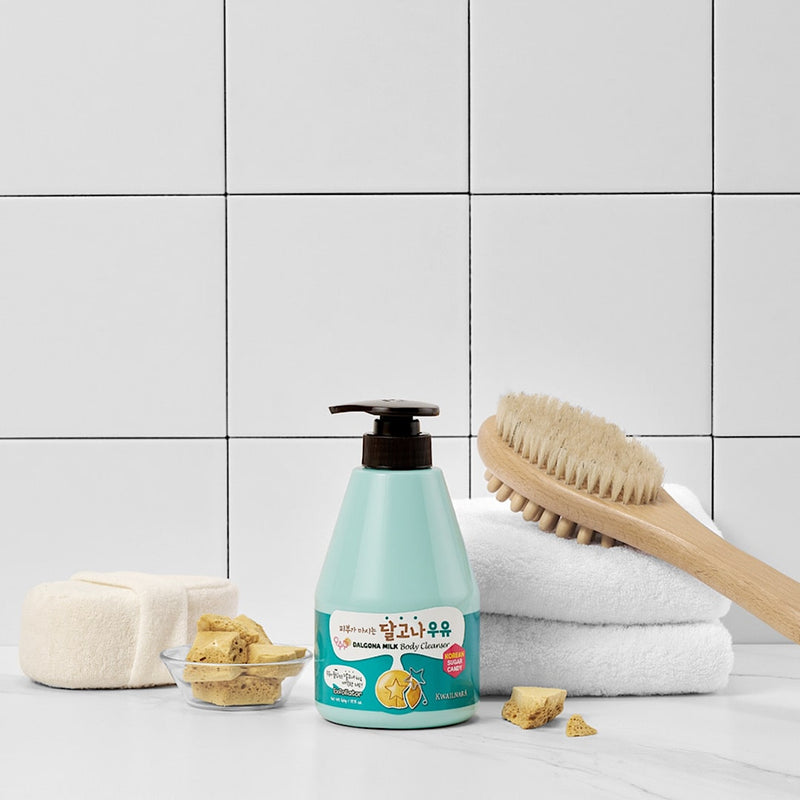 Kwailnara Sugar Candy Milk Body Cleanser styled with milk and candy props, highlighting its nourishing and sweetly fragrant cleansing properties.