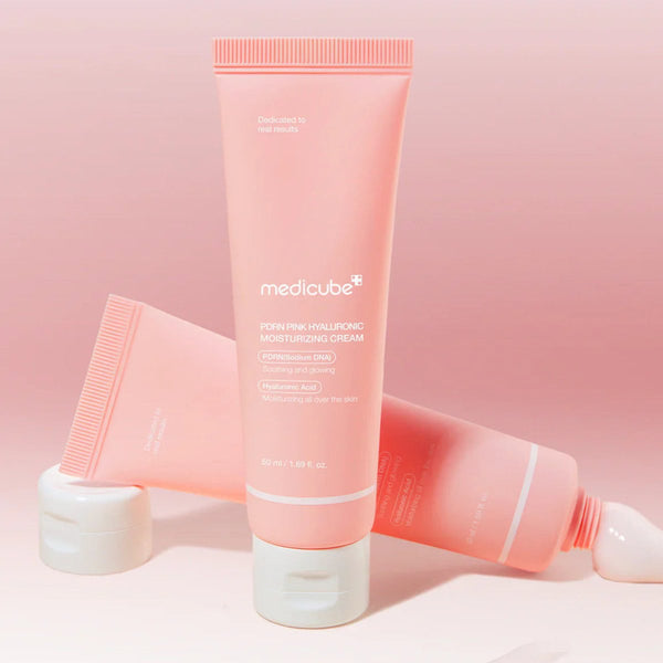 Close-up of Medicube Pink Hyaluronic Moisturizing Cream 50ml to brighten skin, reduce blemishes, and strengthen the skin barrier