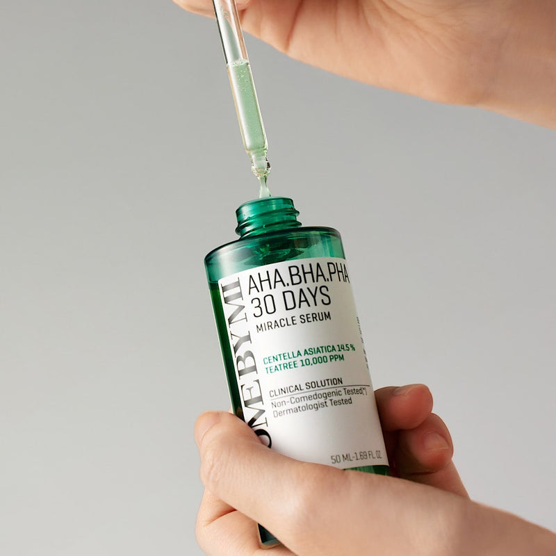 Close-up of SOME BY MI AHA.BHA.PHA 30 Days Miracle Serum, a lightweight exfoliating serum for clearer skin in 30 days, formulated to remove dead skin cells, control sebum, and brighten dull skin with gentle ingredients AHA, BHA, and PHA.