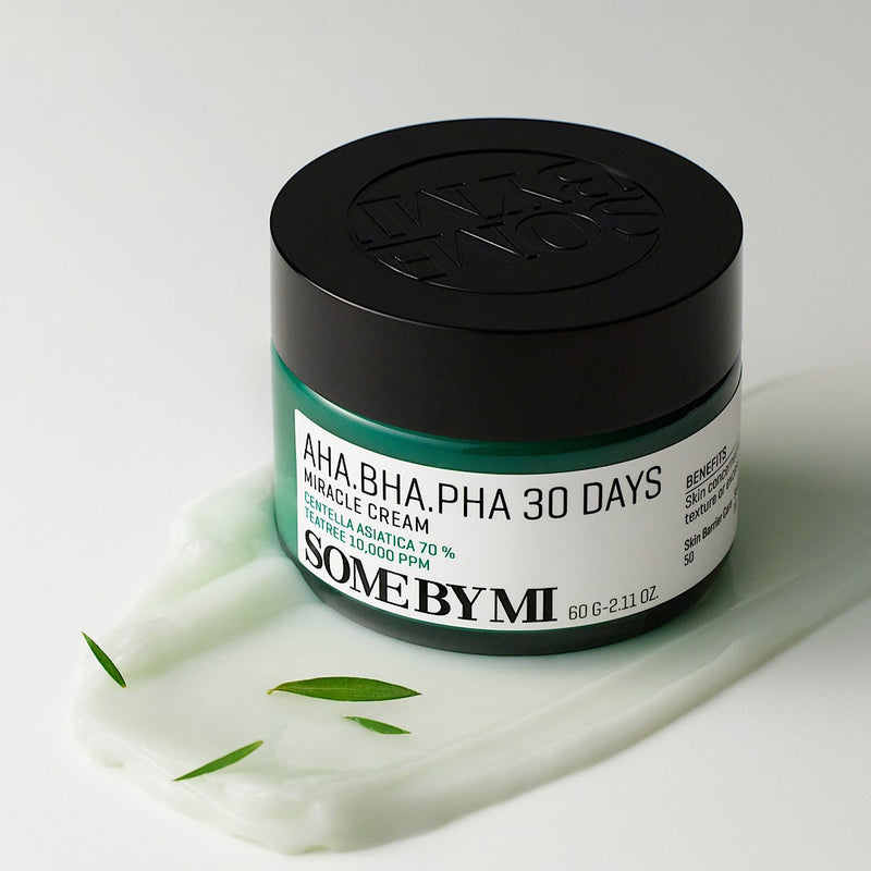 Close-up of SOME BY MI AHA.BHA.PHA 30 Days Miracle Cream, a Korean skincare product known for reducing acne, exfoliating dead skin cells, and minimising pores; features gentle exfoliants AHA, BHA, and PHA for clear and radiant skin in 30 days.